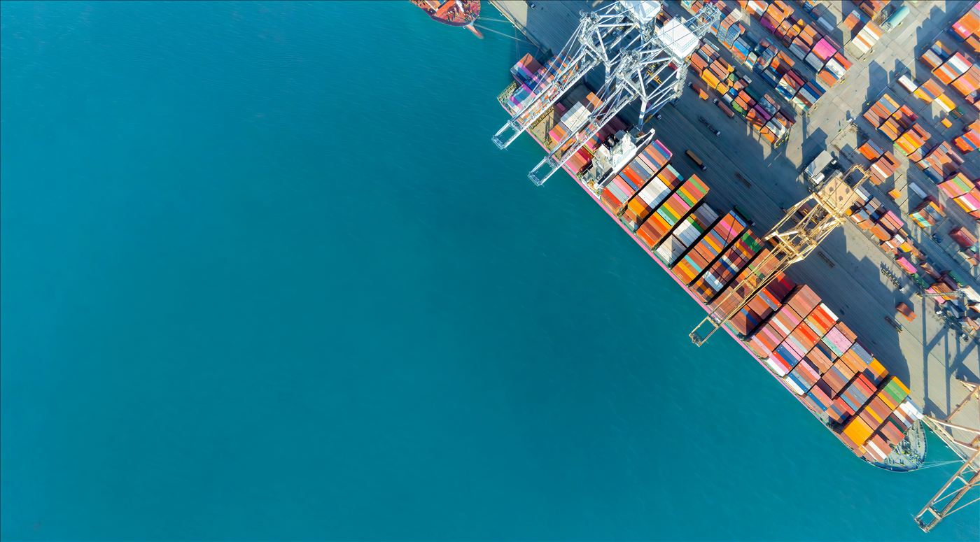 Aerial view of a container ship docked at a port terminal